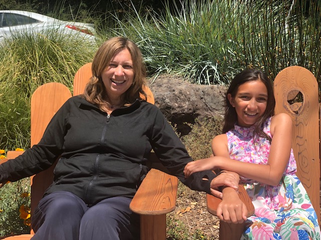 Wendy and her daughter sitting outside Due West